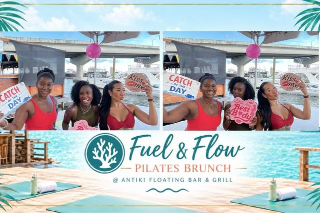 Friends laughing with photo props at a Fuel & Flow Pilates Brunch