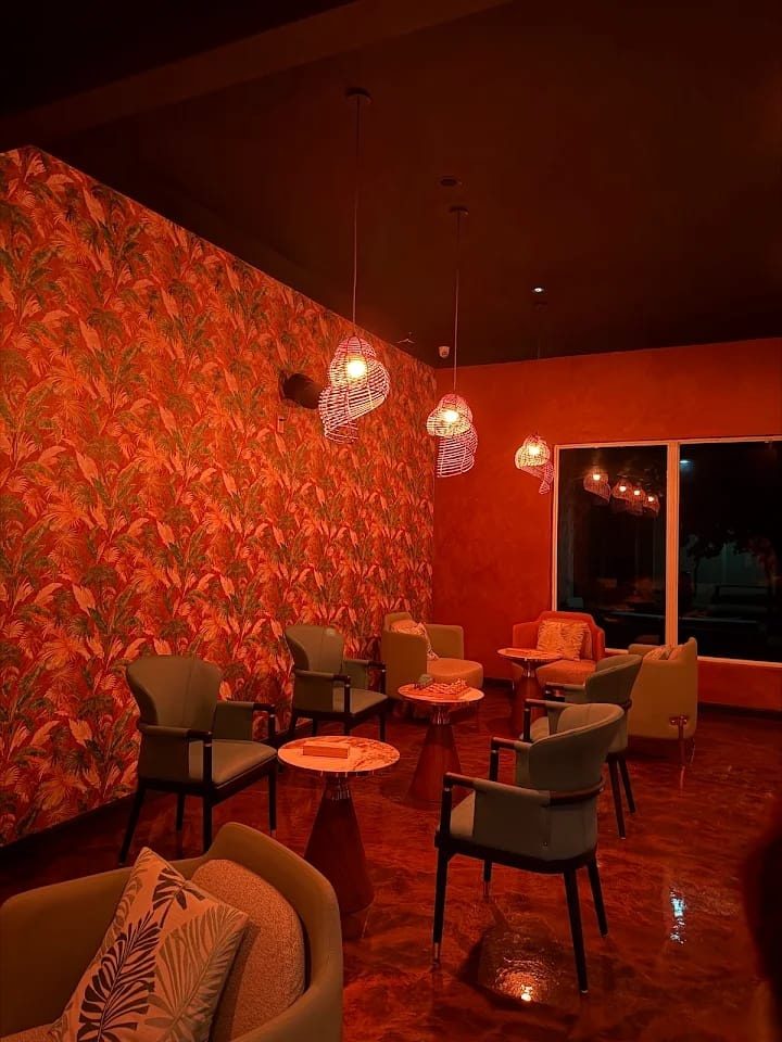 The ROOTZ lounge in the evening, warm red light