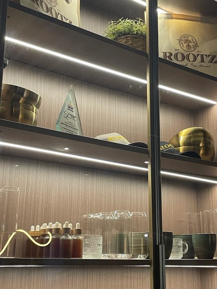 Lit display shelves with ROOTZ teaware